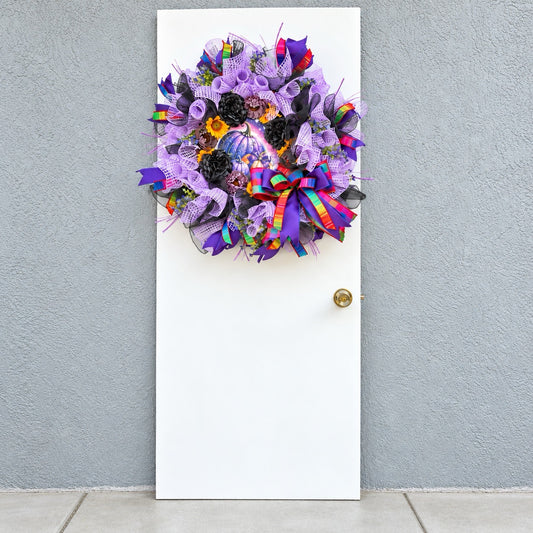 Velvet Eclipse handmade Halloween wreath displayed on a white front door