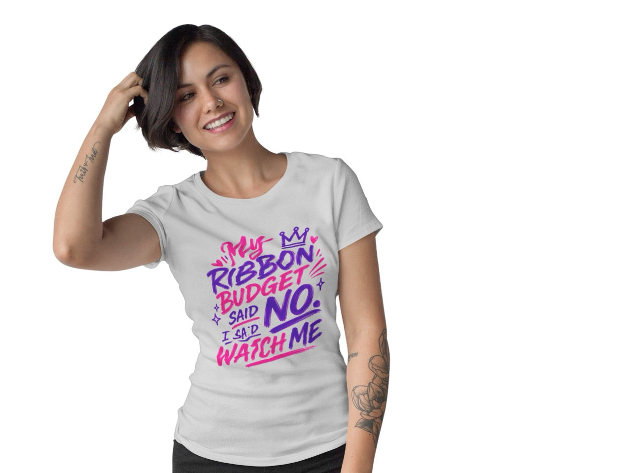 Woman wearing a t-shirt featuring the phrase “My Ribbon Budget Said No, I Said Watch Me” in bold, playful lettering designed for wreath makers, crafters, and ribbon enthusiasts.