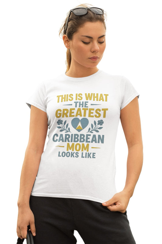 Woman wearing a white T-shirt with text reading “This is what the greatest Caribbean mom looks like,” featuring a heart with island-inspired colors and floral accents.