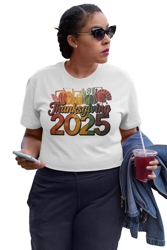 A vibrant Thanksgiving 2025 digital design featuring bold typography and festive fall imagery. The word “Thanksgiving” appears in elegant cursive over large, colorful “2025” numbers. Behind the text are pumpkins, corn, leafy branches, and a turkey — all illustrated in a warm gradient of autumn colors including orange, gold, green, and red. The clean white background highlights the festive, modern design perfect for seasonal decor, apparel, or holiday promotions.