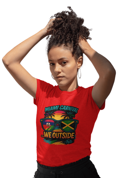 Person wearing a colorful Miami Carnival 2025 t-shirt featuring vibrant tropical artwork, flags, sunglasses, and festive Caribbean-inspired graphics.