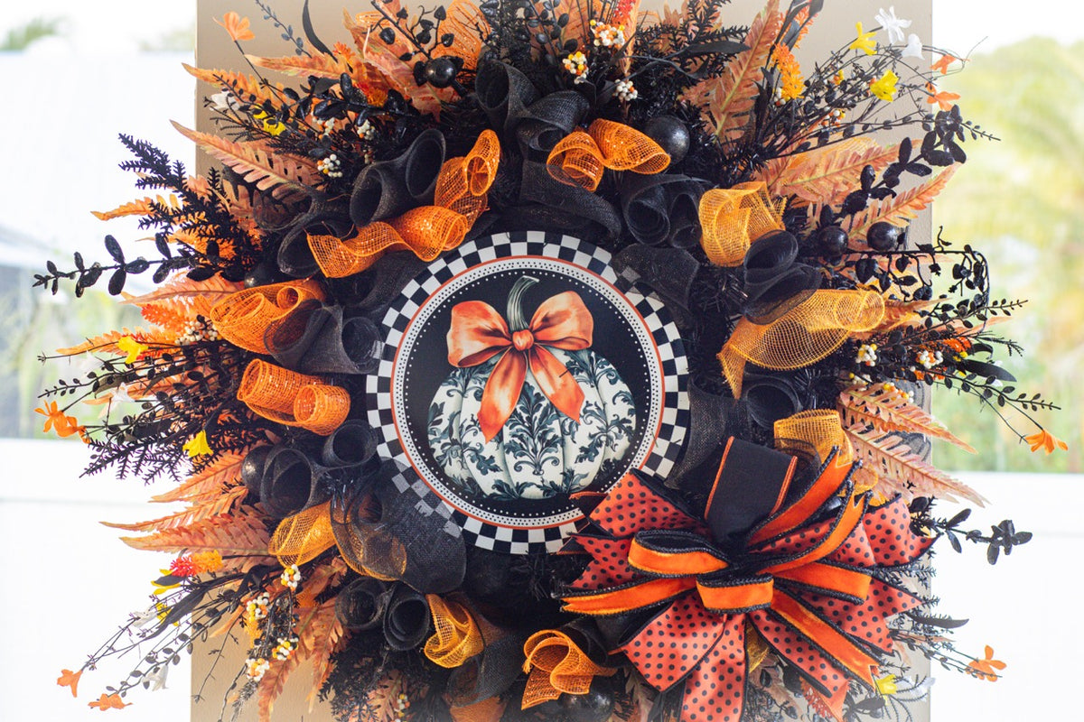 Luxury Halloween wreath with orange bow black mesh and fall foliage