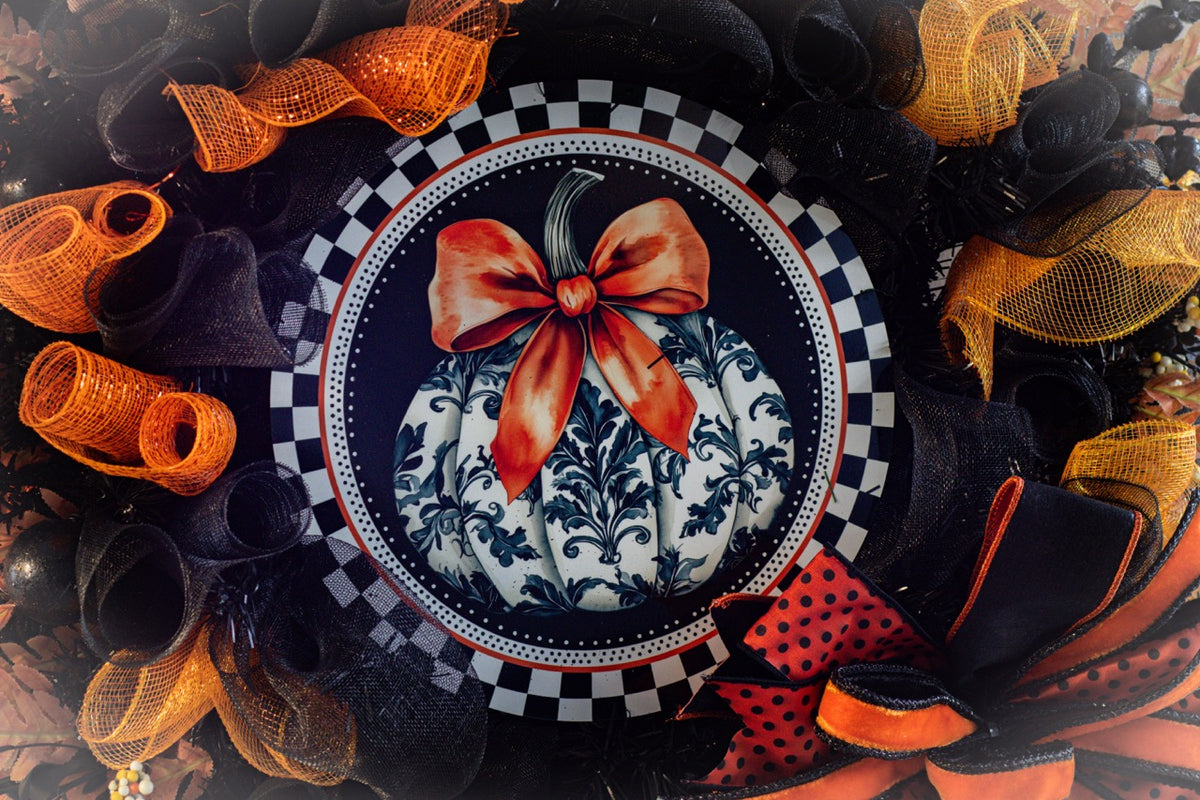 Luxury Halloween wreath with orange bow black mesh and fall foliage