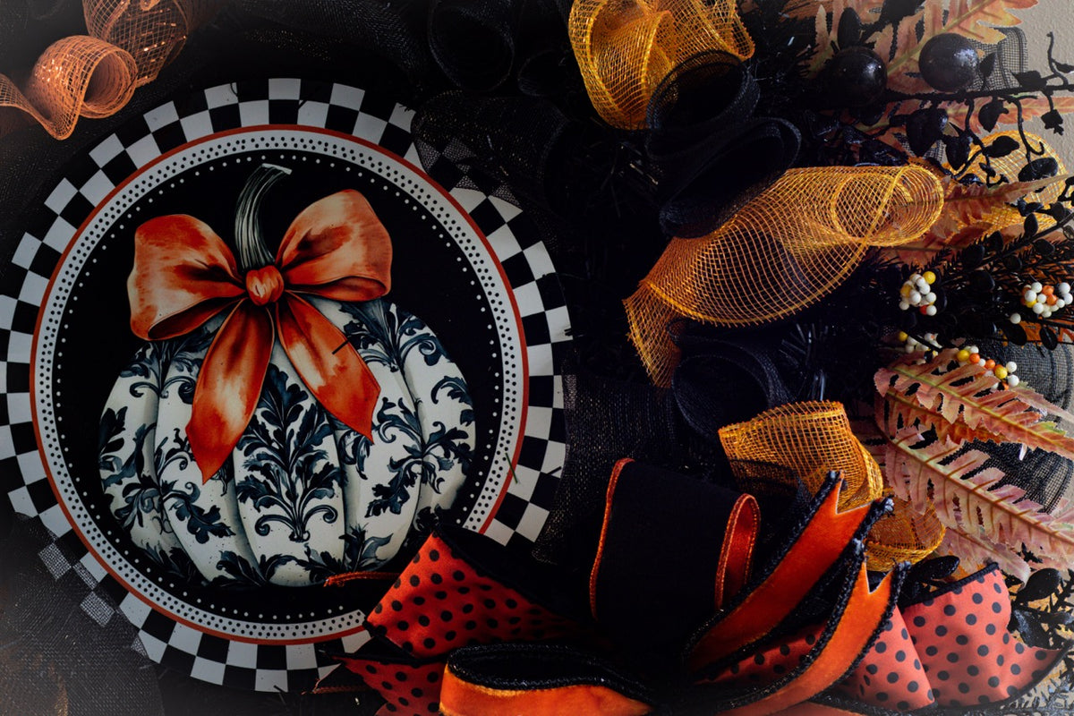 Luxury Halloween wreath with orange bow black mesh and fall foliage