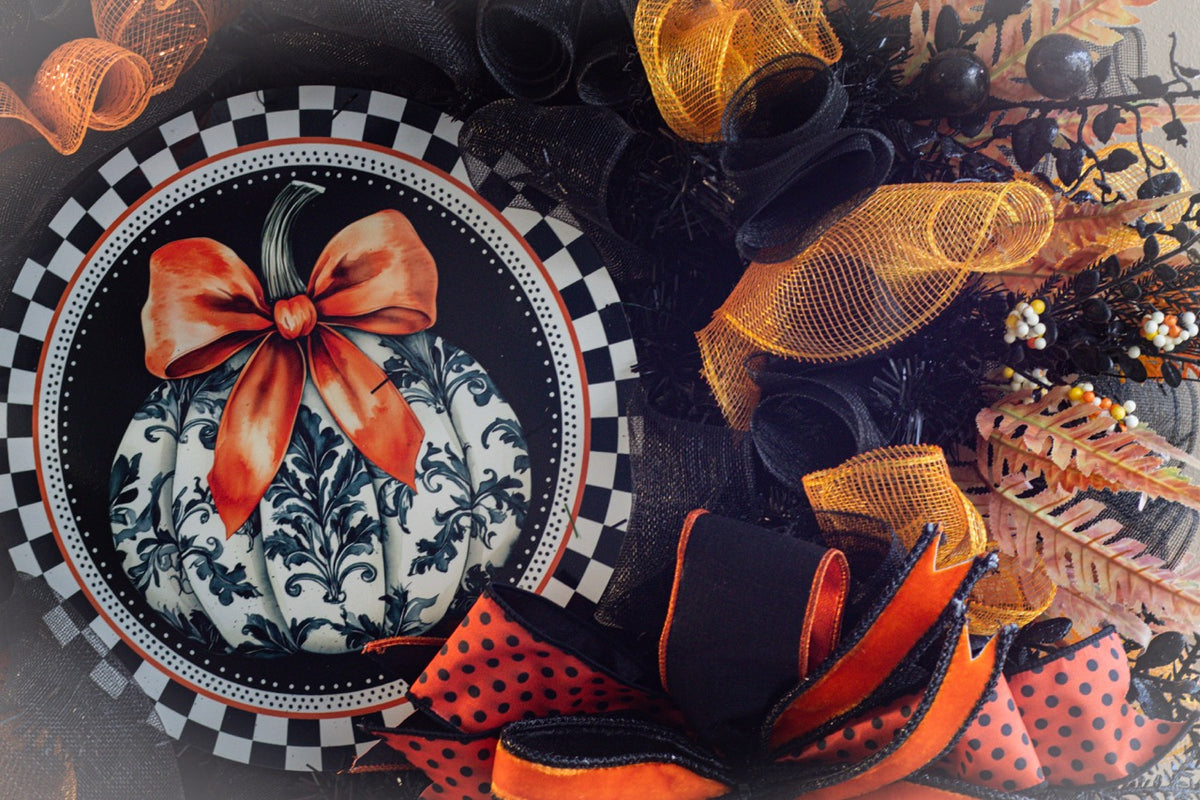 Luxury Halloween wreath with orange bow black mesh and fall foliage
