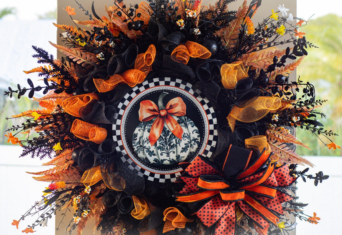 Luxury Halloween wreath with orange bow black mesh and fall foliage