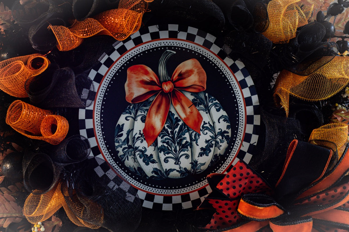 Luxury Halloween wreath with orange bow black mesh and fall foliage