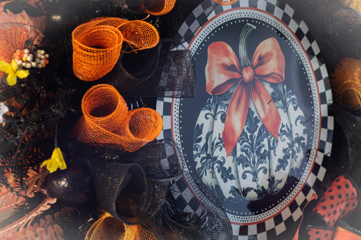 Luxury Halloween wreath with orange bow black mesh and fall foliage