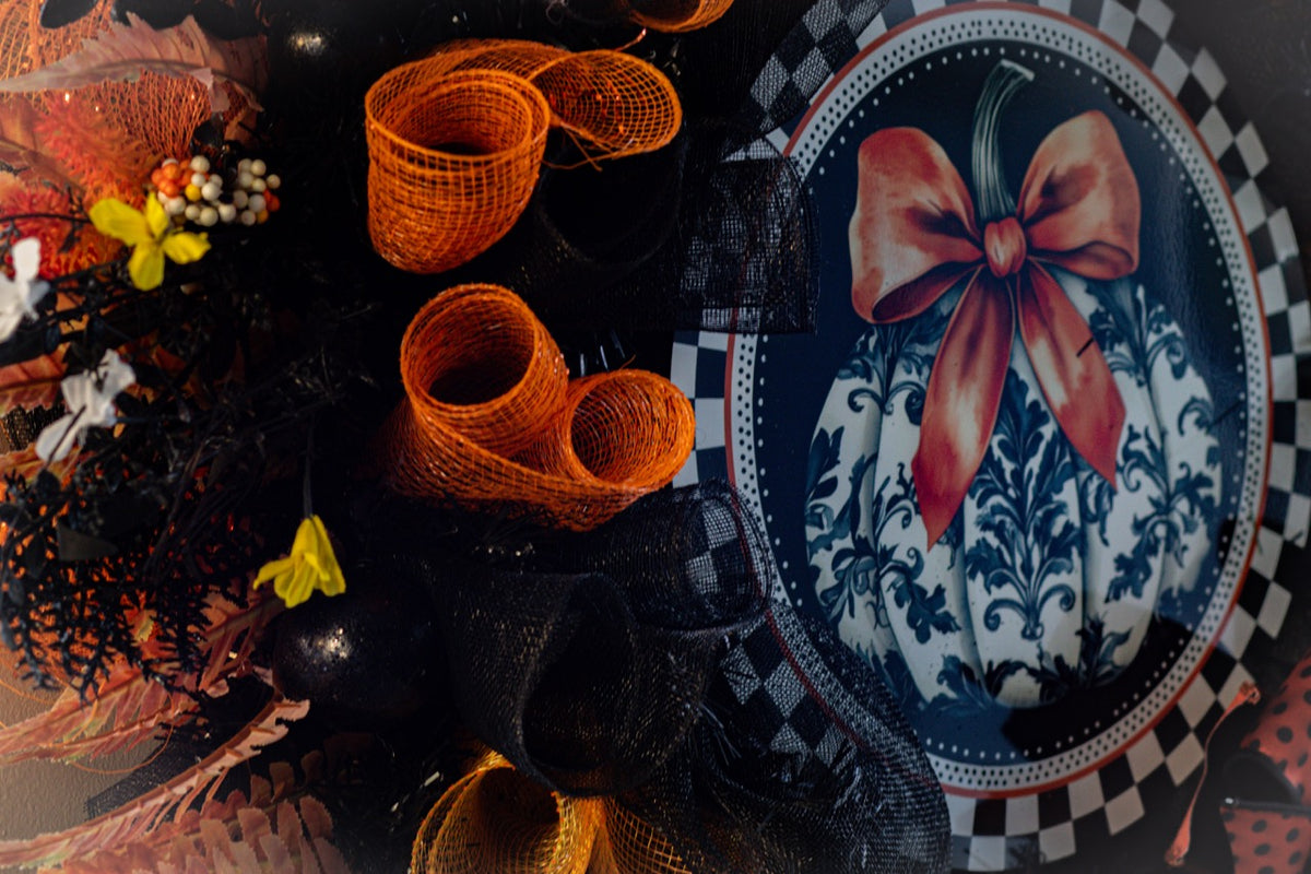 Luxury Halloween wreath with orange bow black mesh and fall foliage