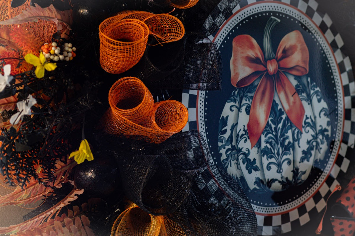 Luxury Halloween wreath with orange bow black mesh and fall foliage