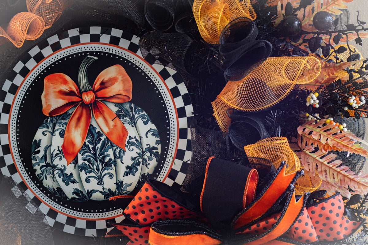 Luxury Halloween wreath with orange bow black mesh and fall foliage