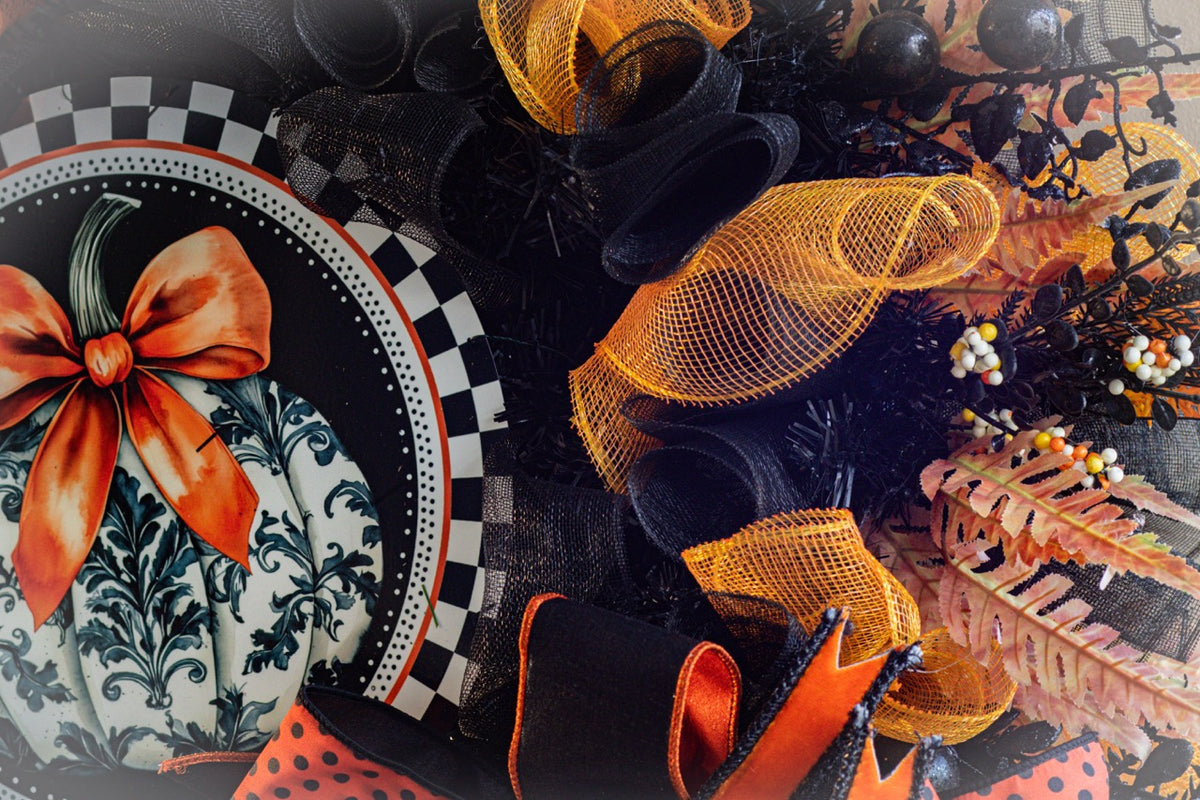 Luxury Halloween wreath with orange bow black mesh and fall foliage