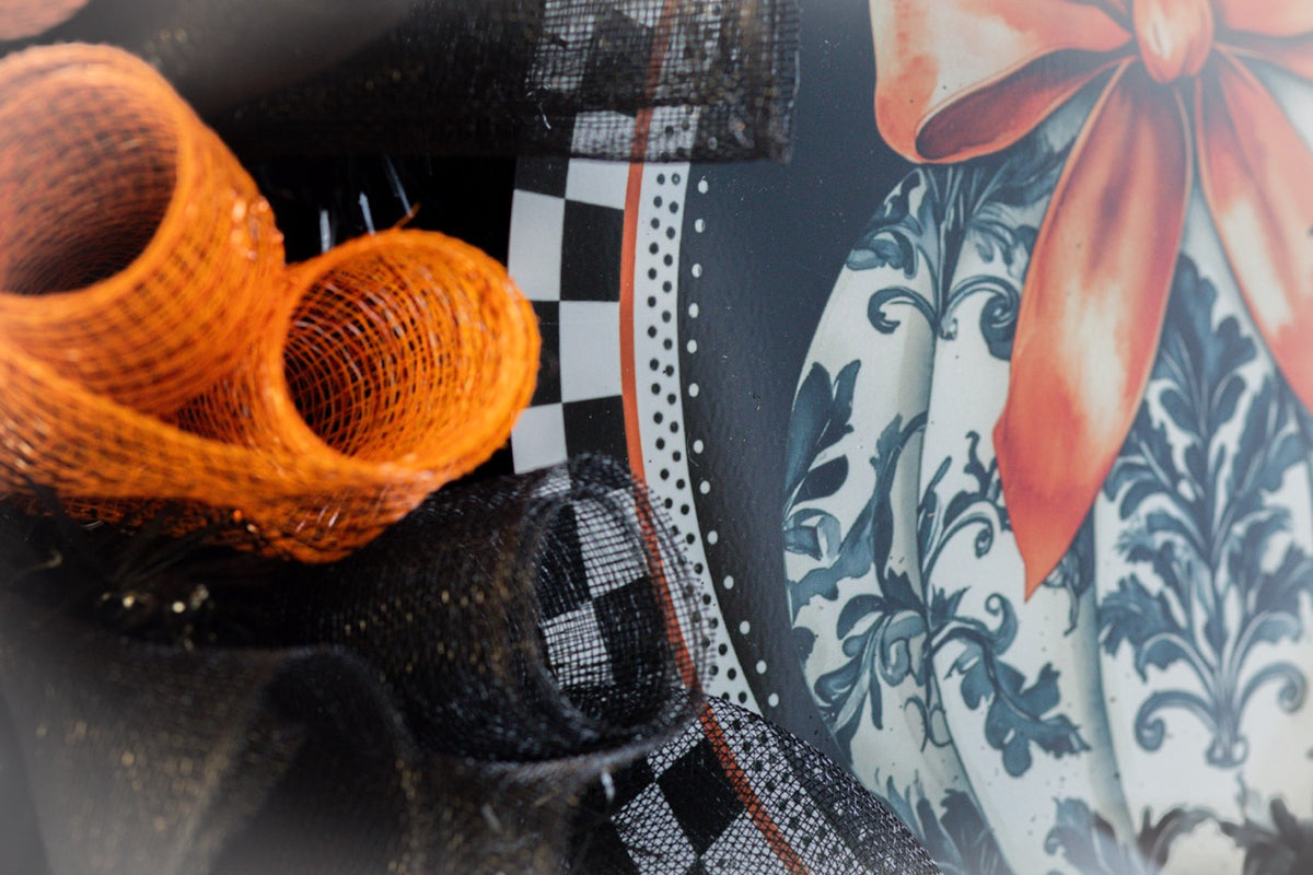 Luxury Halloween wreath with orange bow black mesh and fall foliage
