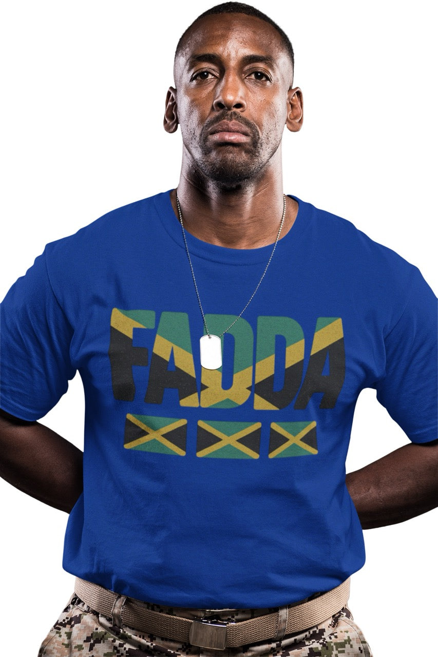 Man wearing a navy T-shirt with bold “FADA” text in Jamaican flag colors and three Jamaican flag icons underneath.