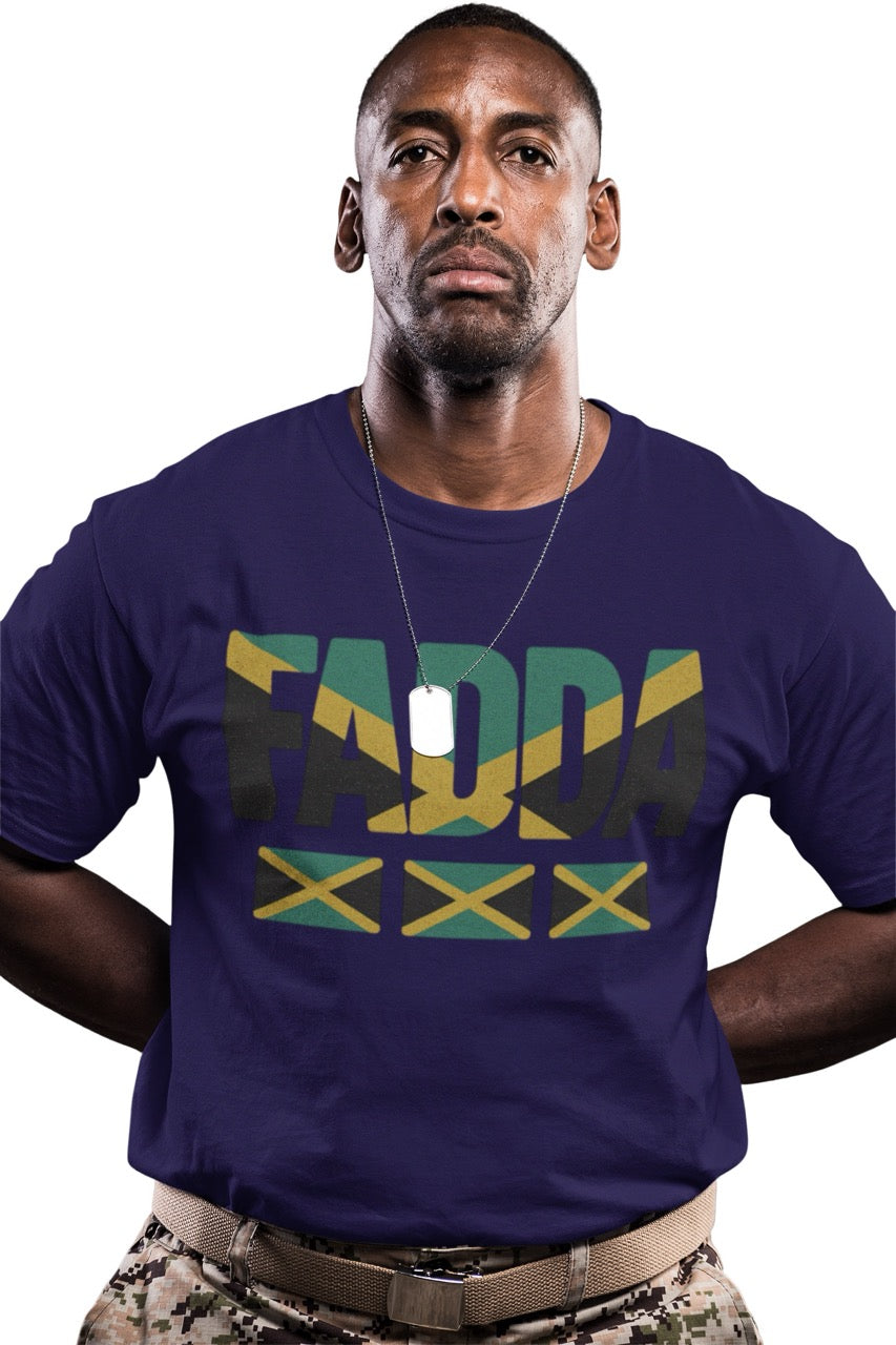 Man wearing a purple T-shirt with bold “FADA” text in Jamaican flag colors and three Jamaican flag icons underneath.