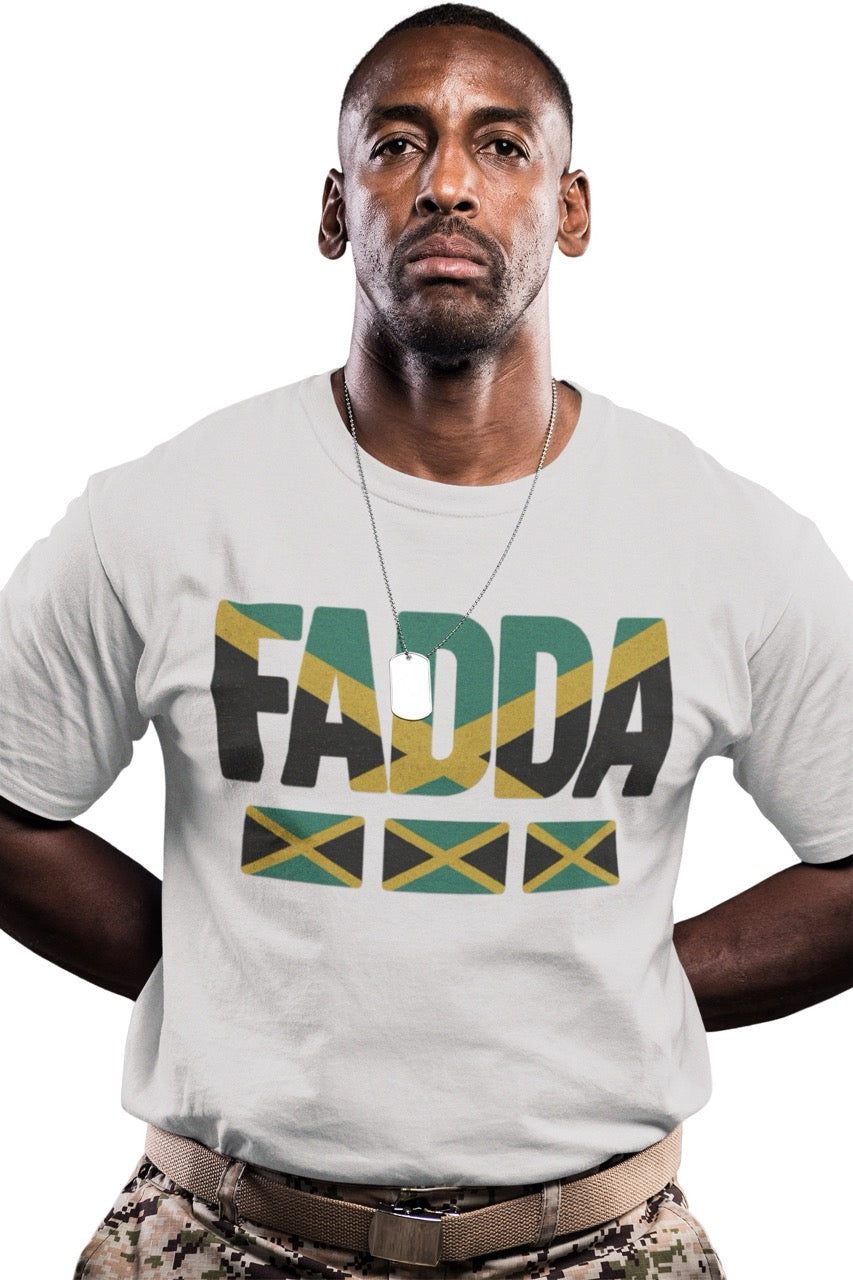 Man wearing a white T-shirt with bold “FADA” text in Jamaican flag colors and three Jamaican flag icons underneath.