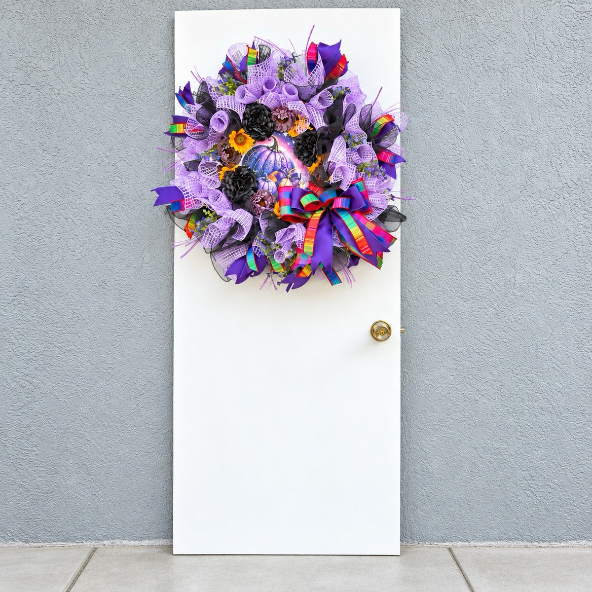 Velvet Eclipse handmade Halloween wreath displayed on a white front door