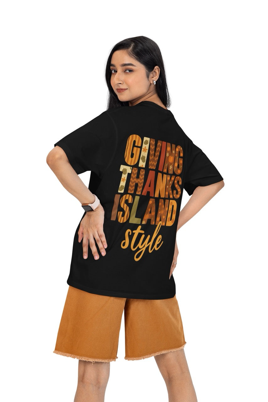 A festive Caribbean-inspired Thanksgiving design featuring the bold phrase “Giving Thanks Island Style.” Each letter is decorated with warm fall patterns — including pumpkins, acorns, stripes, zigzags, and florals — in shades of orange, brown, cream, and green. The background glows with a soft amber and golden gradient, creating a cozy island sunset effect. The word “style” is written in a flowing script beneath the block letters, completing the vibrant, tropical fall theme.