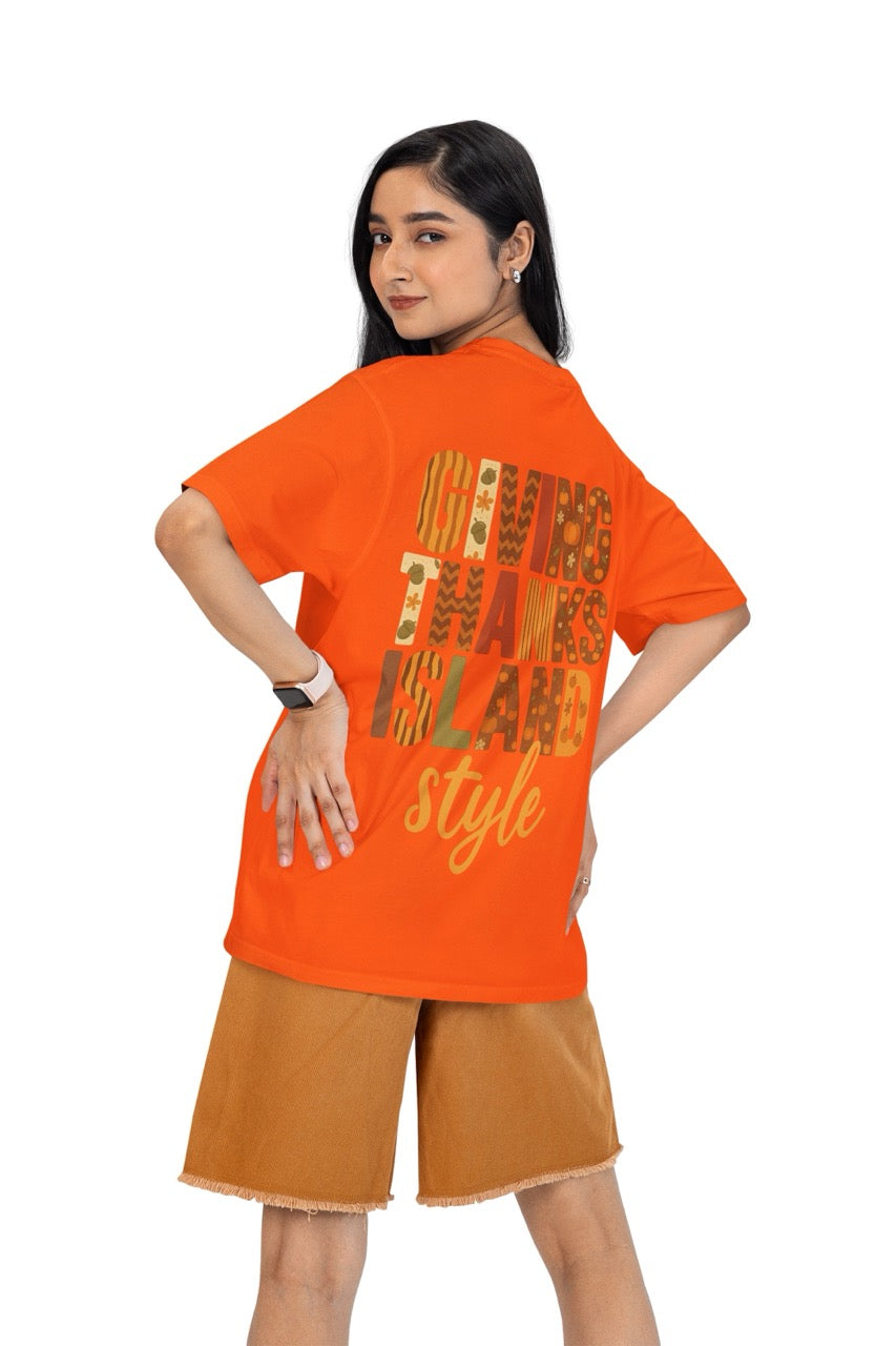A festive Caribbean-inspired Thanksgiving design featuring the bold phrase “Giving Thanks Island Style.” Each letter is decorated with warm fall patterns — including pumpkins, acorns, stripes, zigzags, and florals — in shades of orange, brown, cream, and green. The background glows with a soft amber and golden gradient, creating a cozy island sunset effect. The word “style” is written in a flowing script beneath the block letters, completing the vibrant, tropical fall theme.