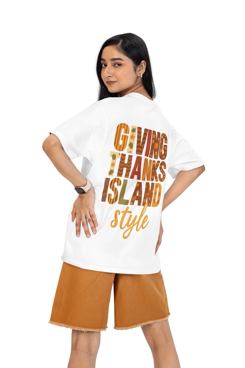 A festive Caribbean-inspired Thanksgiving design featuring the bold phrase “Giving Thanks Island Style.” Each letter is decorated with warm fall patterns — including pumpkins, acorns, stripes, zigzags, and florals — in shades of orange, brown, cream, and green. The background glows with a soft amber and golden gradient, creating a cozy island sunset effect. The word “style” is written in a flowing script beneath the block letters, completing the vibrant, tropical fall theme.