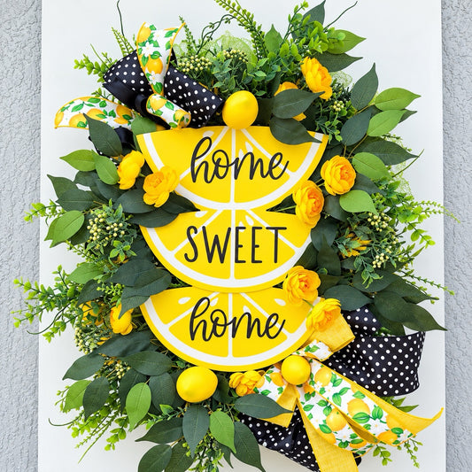 Handmade Lemon Sweet Home Summer Wreath featuring a yellow lemon-slice Home Sweet Home sign, bright yellow roses, decorative lemons, lush green foliage, and black-and-white polka-dot ribbon displayed on a white door.