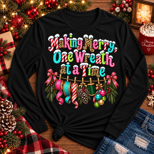 Making Merry One Wreath at a Time black Christmas wreath maker shirt with colorful ribbon and crafting design