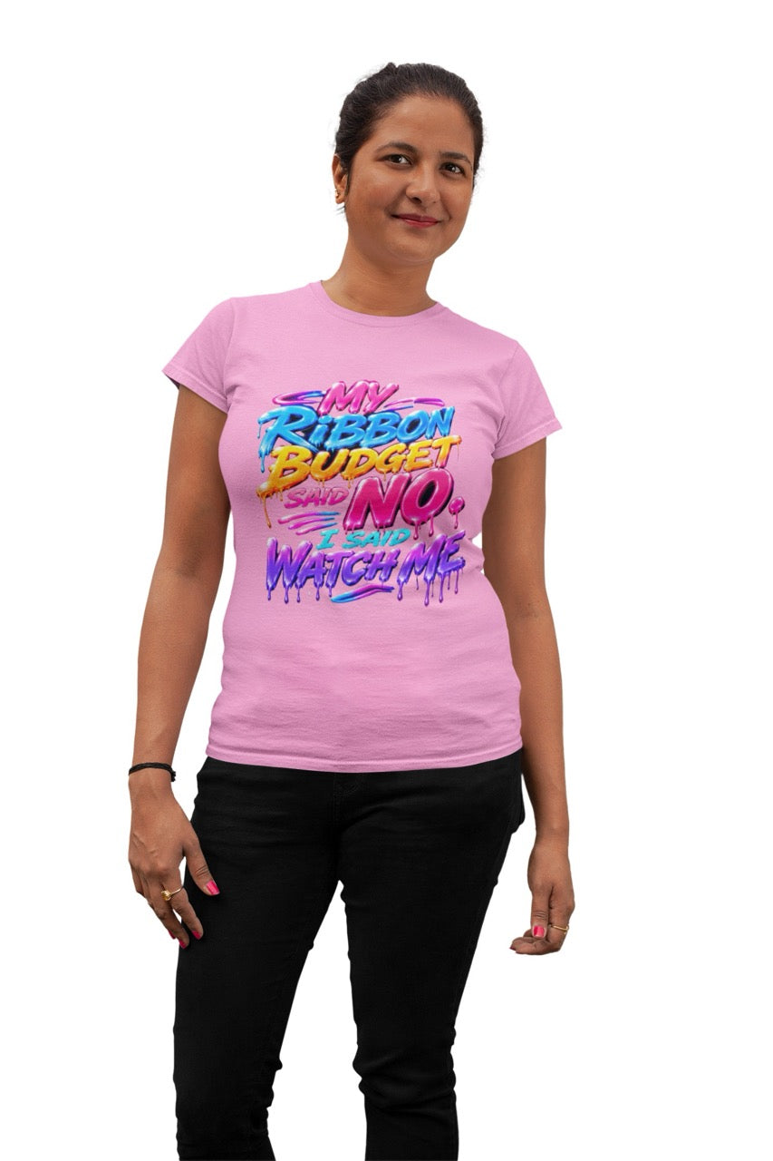 Graphic t-shirt featuring the phrase “My Ribbon Budget Said No, I Said Watch Me” in bold colorful lettering with a dripping paint effect, designed for wreath makers, crafters, and ribbon enthusiasts.