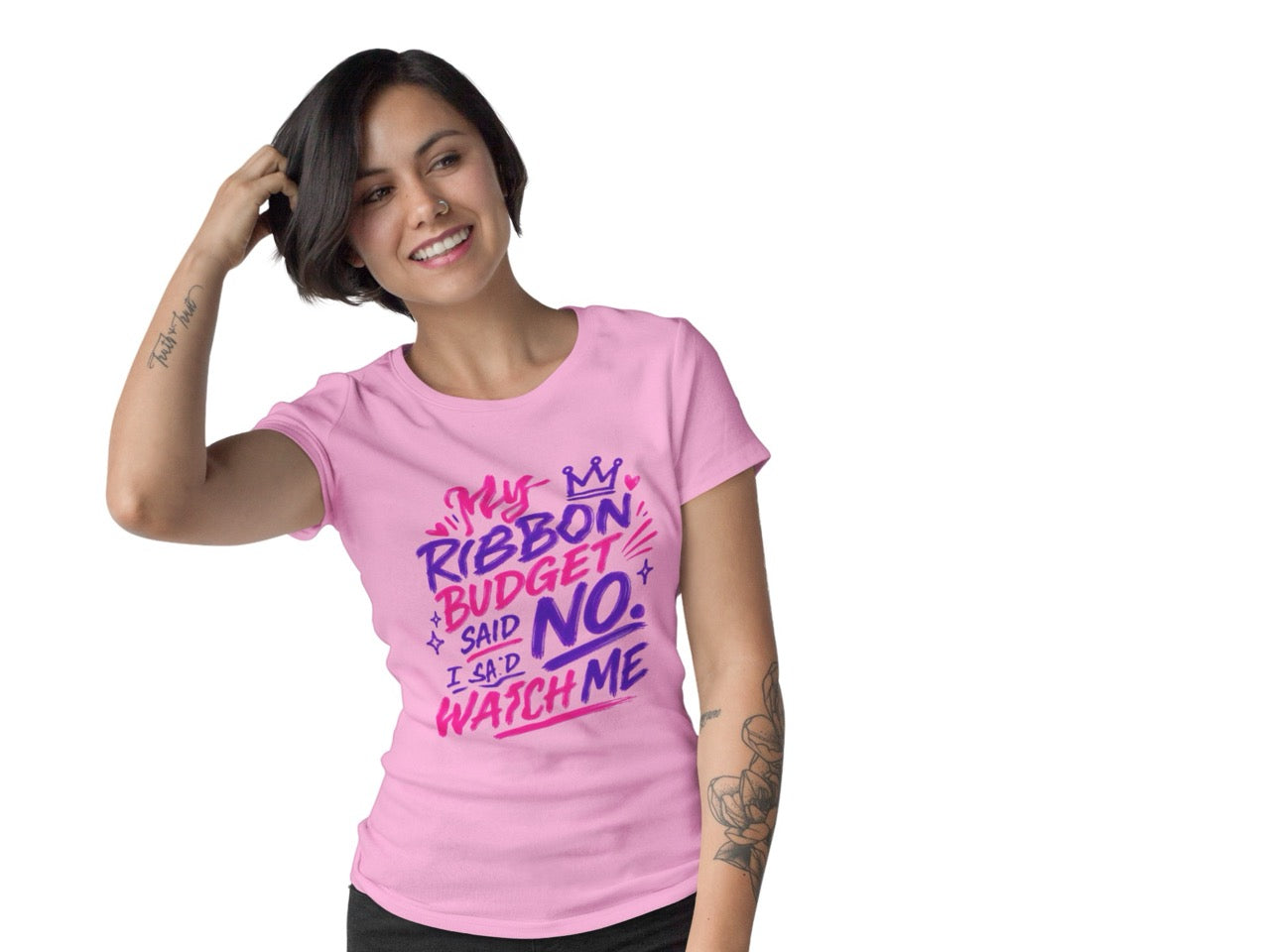 Woman wearing a t-shirt featuring the phrase “My Ribbon Budget Said No, I Said Watch Me” in bold, playful lettering designed for wreath makers, crafters, and ribbon enthusiasts.
