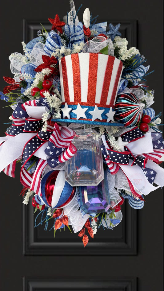 Patriotic Uncle Sam wreath with red white and blue ribbons glitter top hat stars and mesh perfect for 4th of July front door decor