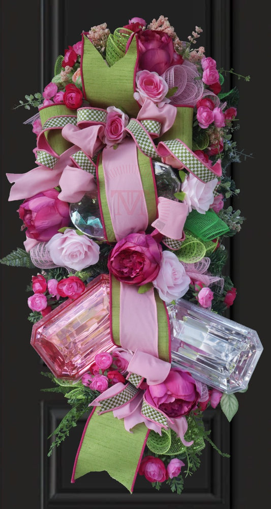 Pink floral gift box swag wreath with peonies, roses, green ribbon, and elegant front door decor