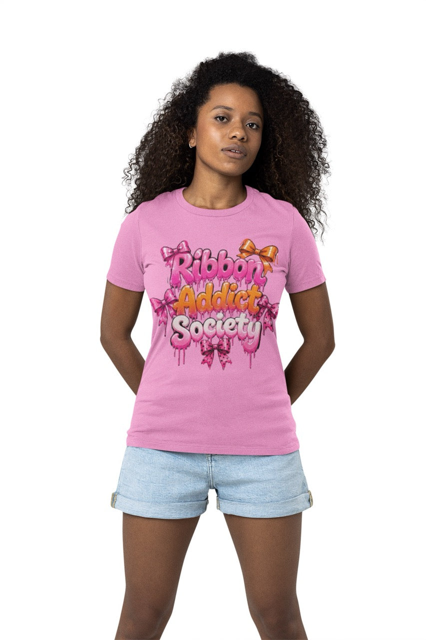 Ribbon Addict Society t-shirt featuring bold decorative lettering with bow accents and a fun crafting-themed graphic design for wreath makers and ribbon enthusiasts.