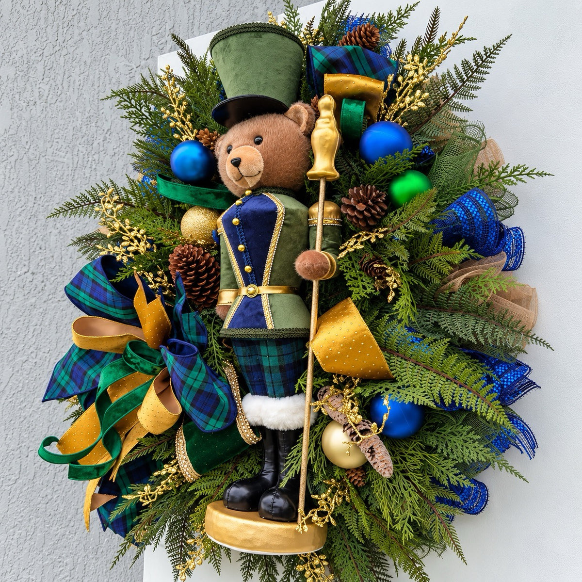 Side view showing the depth and layered greenery of the handmade Christmas wreath.