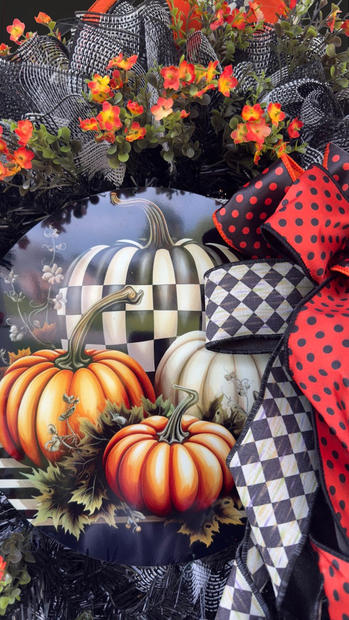 Harlequin Harvest Manor Wreath featuring lavender deco mesh, black florals, vibrant harlequin ribbon, sunflowers, and a whimsical purple pumpkin centerpiece displayed on a black front door.