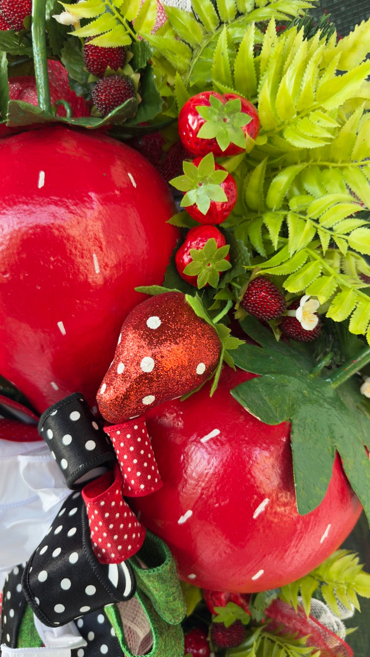 Luxury handmade strawberry door swag with oversized red strawberries, glitter strawberry ornaments, bright green foliage, white flowers, and a designer black, red, white, and green ribbon bow, perfect for summer front door décor and farmhouse-style decorating. 🍓✨