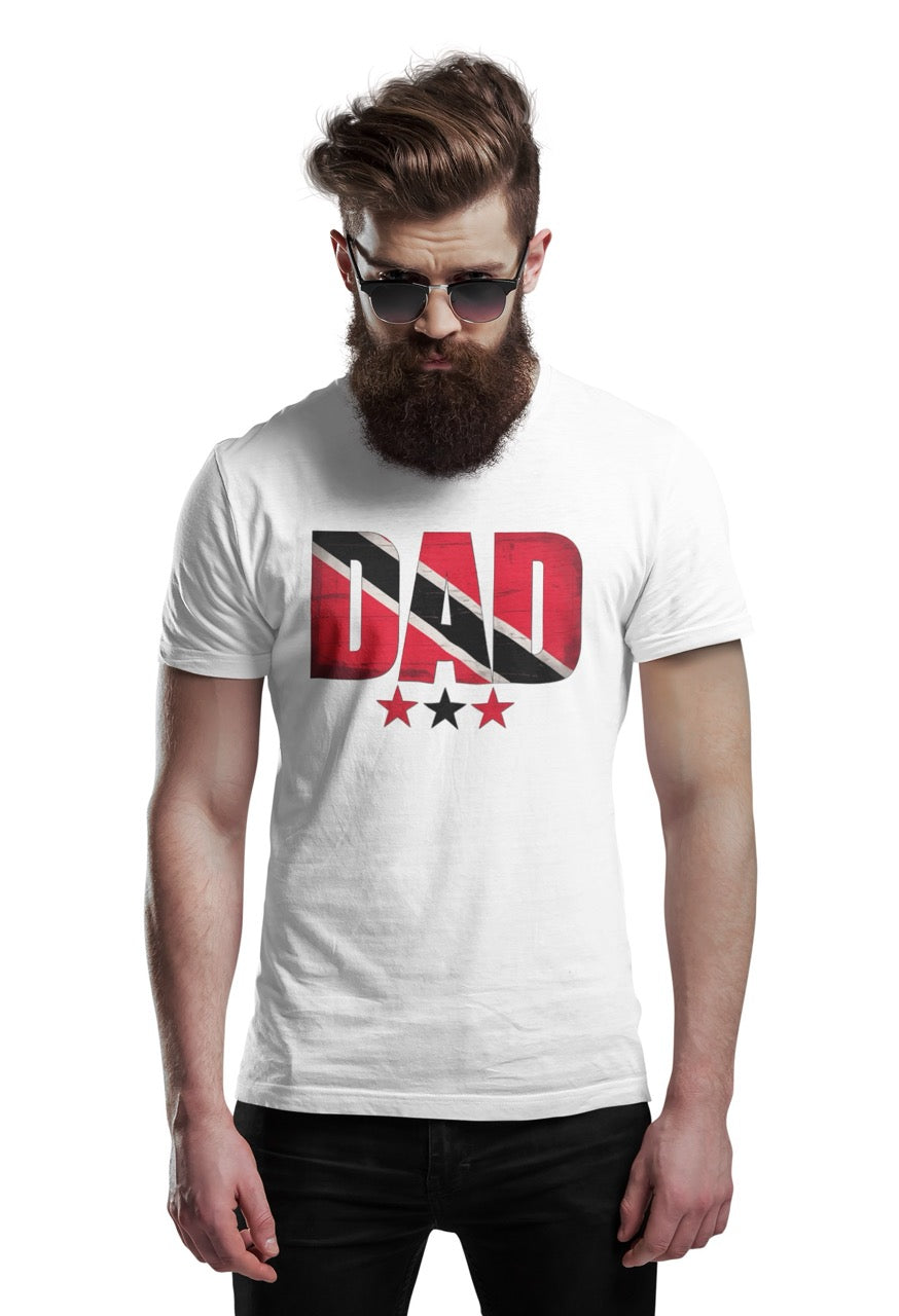 Man wearing a white  T-shirt featuring bold “DAD” text filled with the Trinidad and Tobago flag colors, with three stars beneath the design.