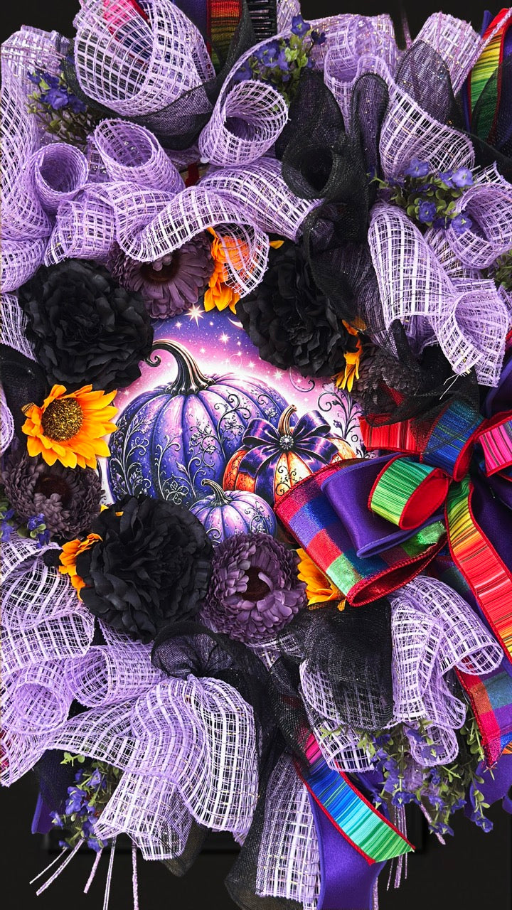 Velvet Eclipse luxury handmade Halloween wreath featuring lavender deco mesh, black florals, colorful designer ribbon bow, sunflowers, and a whimsical purple pumpkin centerpiece displayed on a black front door.