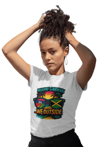 Person wearing a colorful Miami Carnival 2025 t-shirt featuring vibrant tropical artwork, flags, sunglasses, and festive Caribbean-inspired graphics.