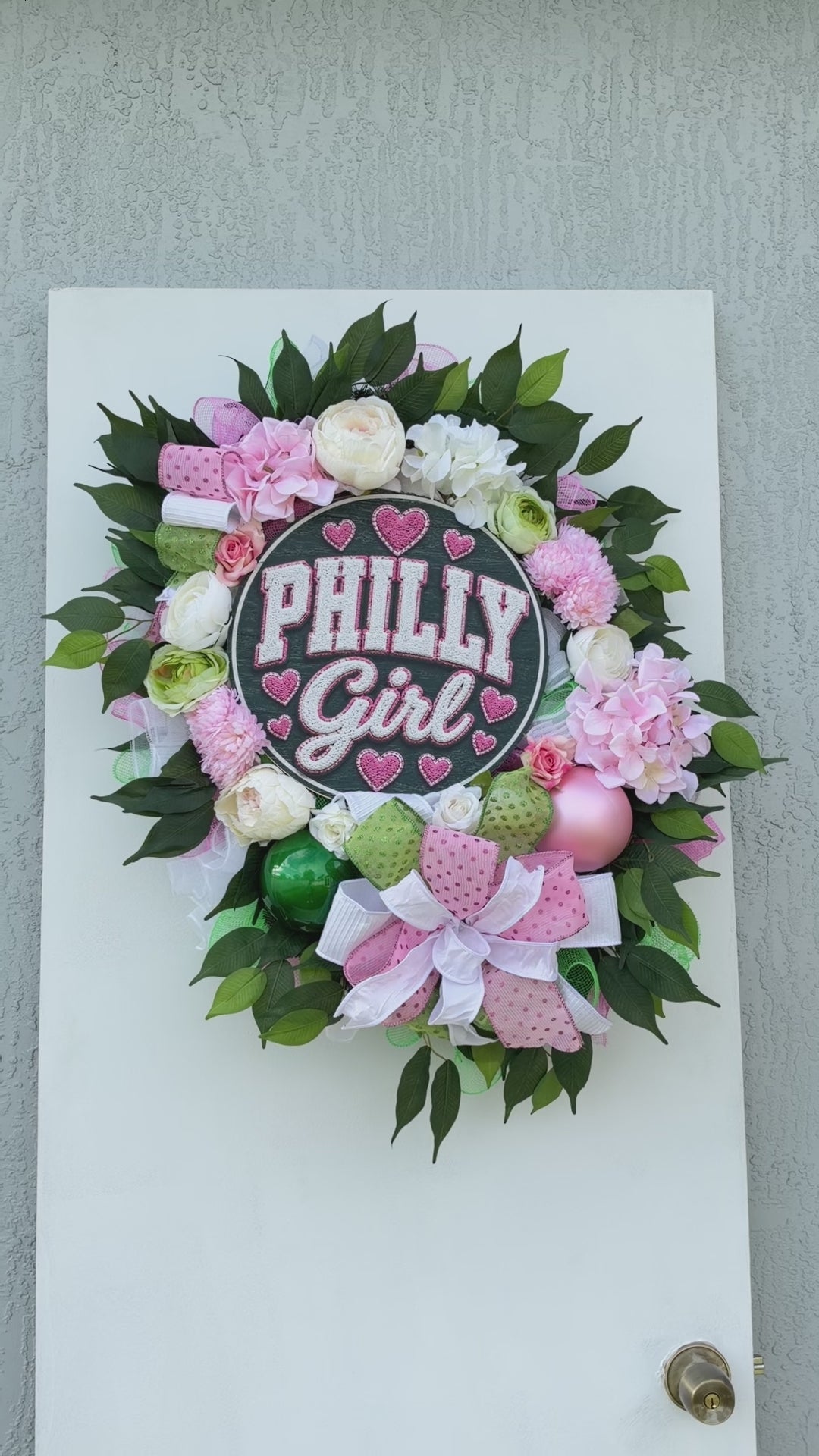 Philadelphia-inspired Philly Girl pink and green floral wreath displayed as colorful front door decor.