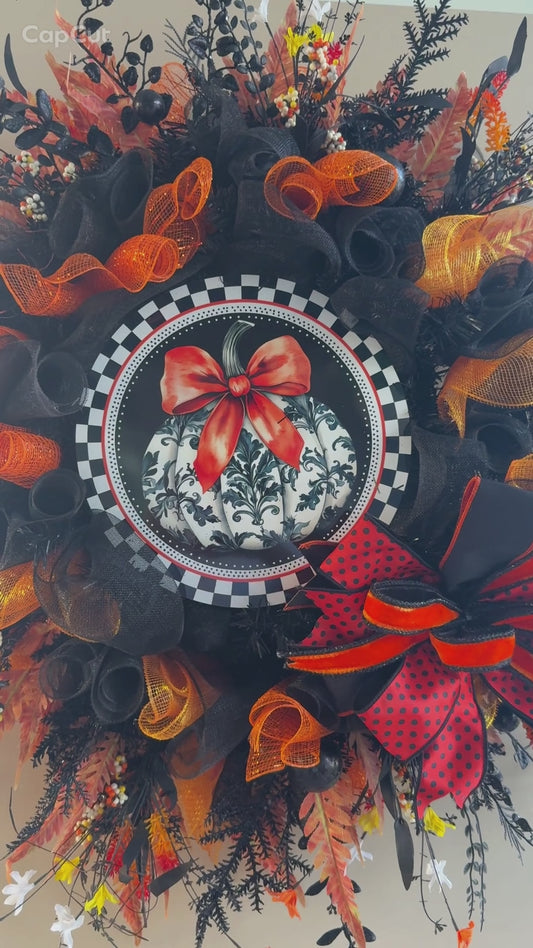 Luxury Halloween wreath with orange bow black mesh and fall foliage