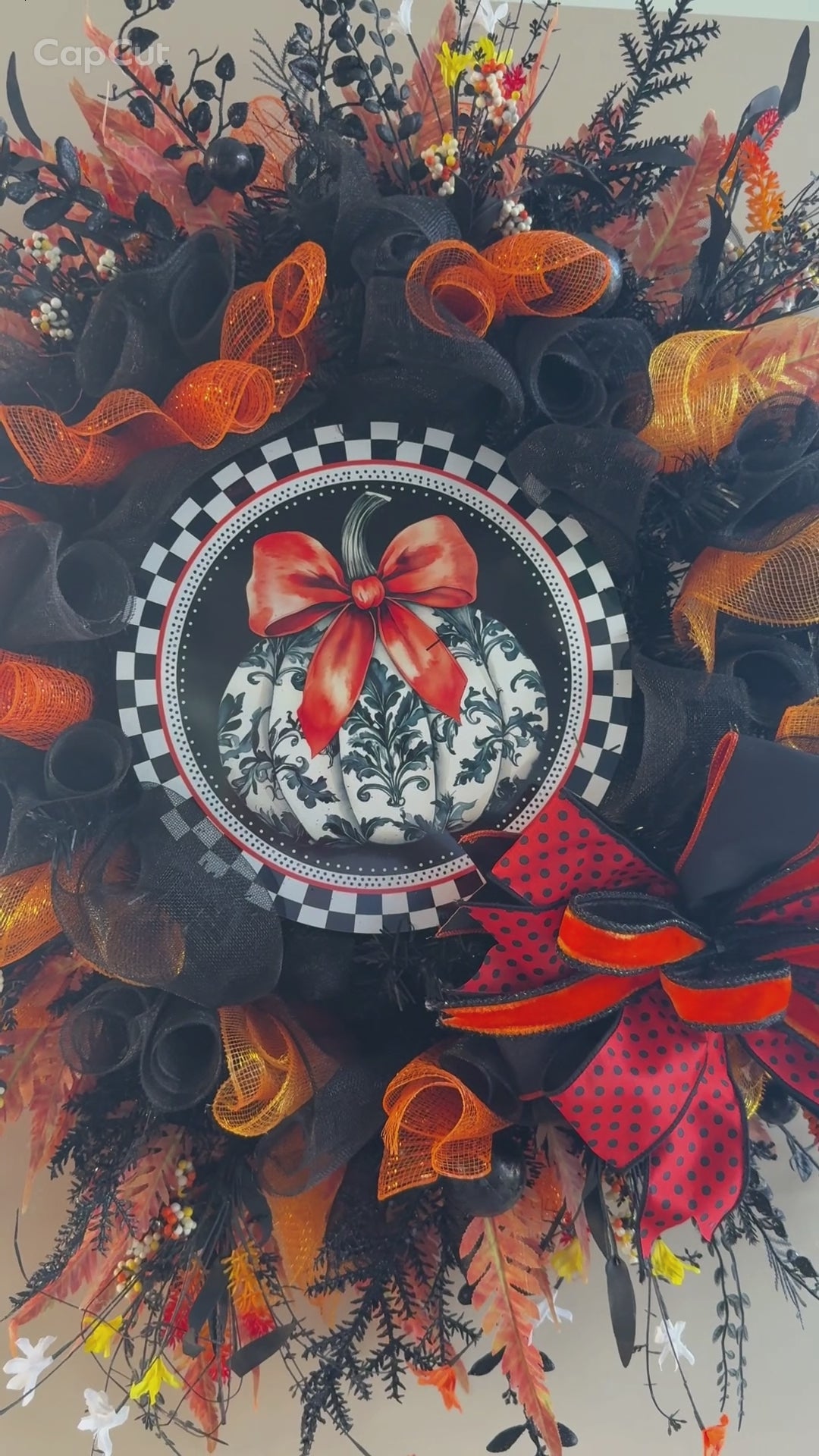 Luxury Halloween wreath with orange bow black mesh and fall foliage