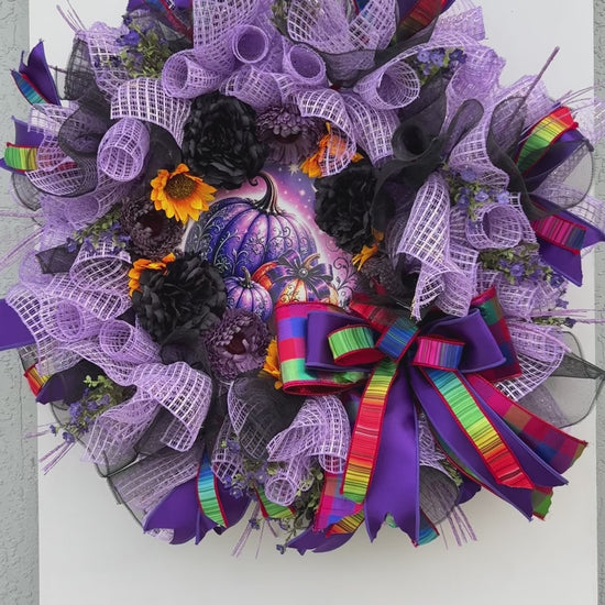Velvet Eclipse handmade Halloween wreath displayed on a white front door