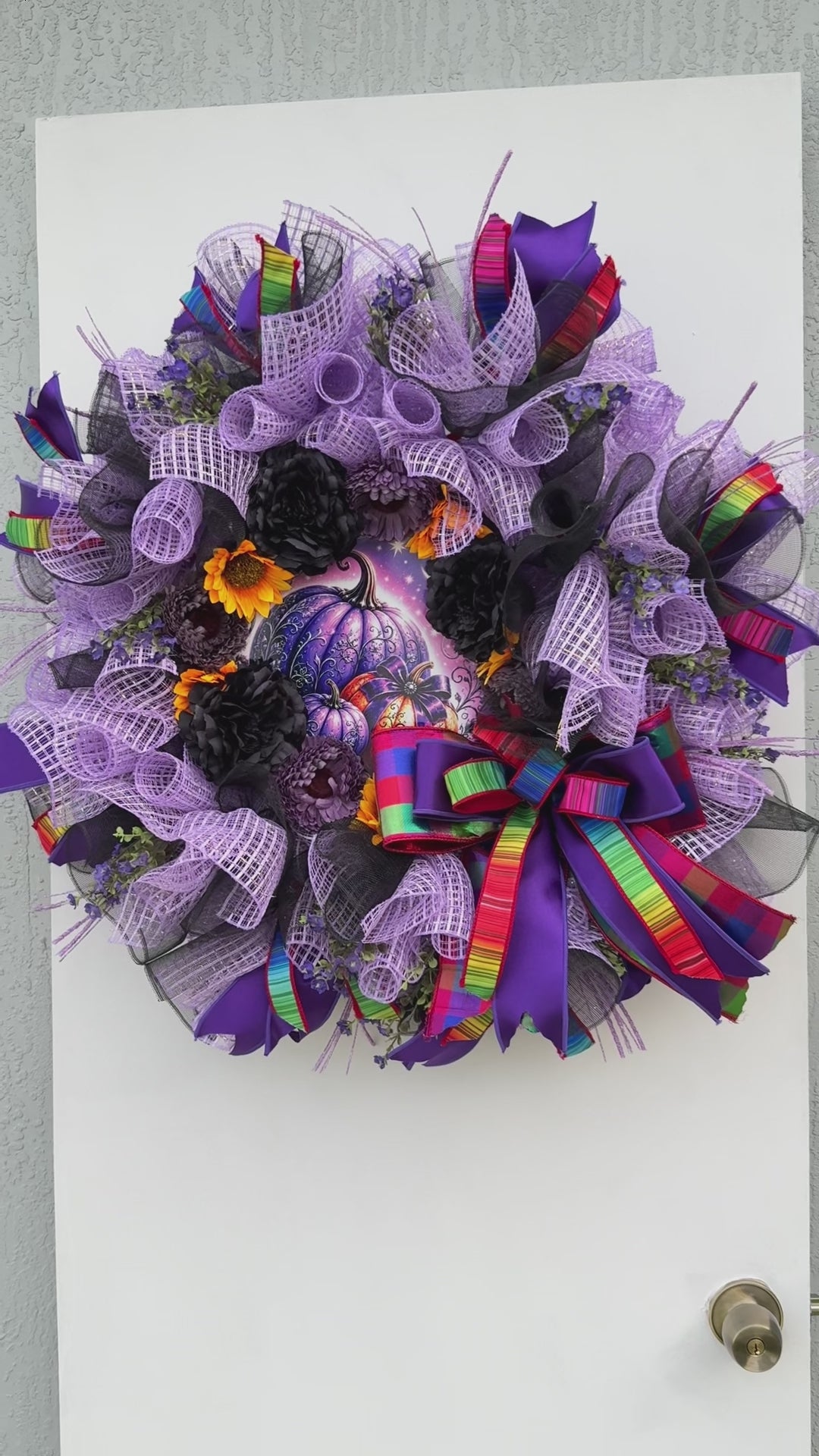 Velvet Eclipse handmade Halloween wreath displayed on a white front door